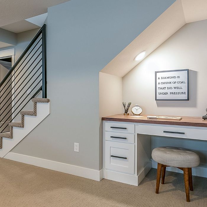 Built in desk under the stairs in basement remodel made by general contractor in Walnut Creek, CA.