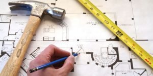 A general contractor drawing a blueprint in Walnut Creek, CA