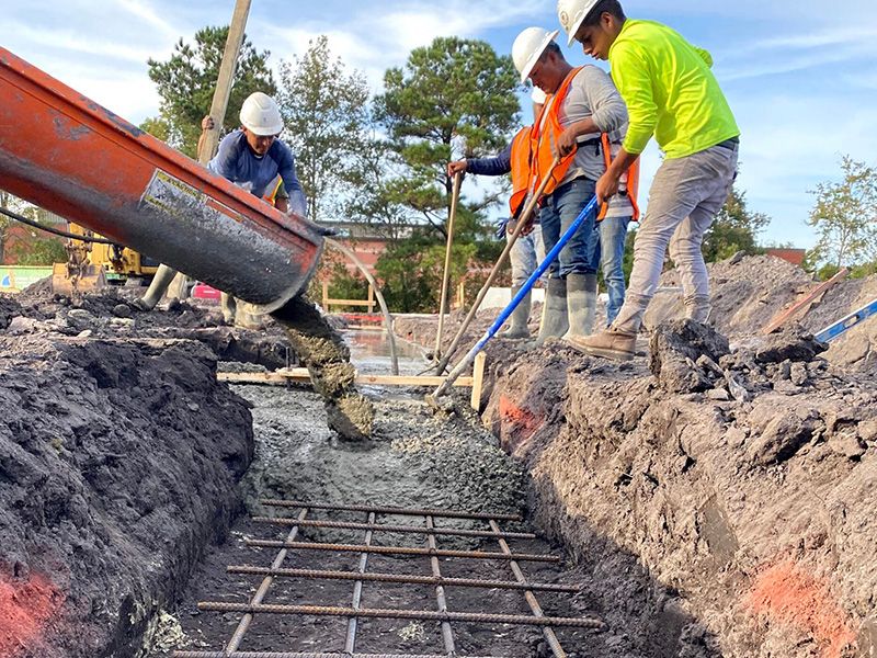 Rebar and concrete being poured at a commercial construction project by concrete contractors in Walnut Creek, CA.