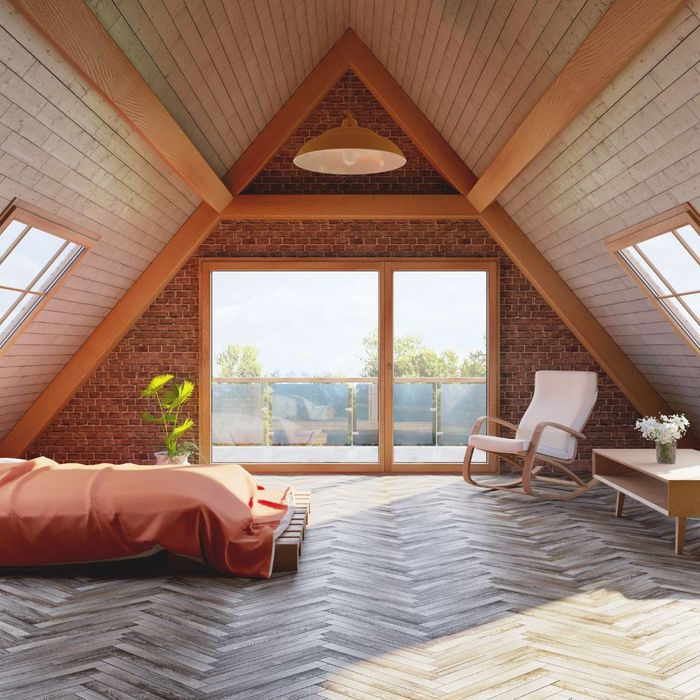 Attic bedroom with brick walls and wooden flooring by general contractor in Walnut Creek, CA