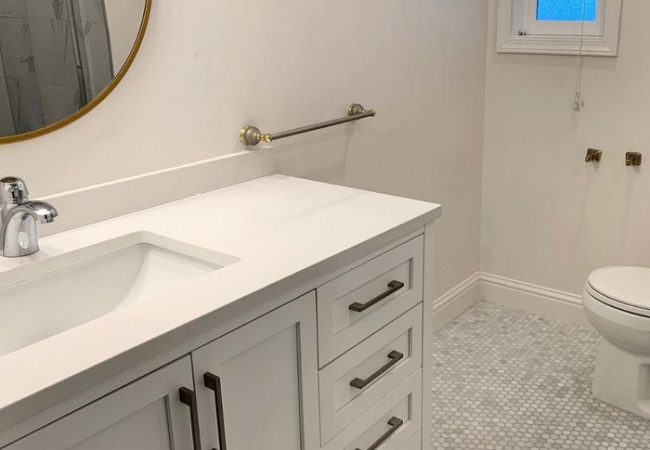 White bathroom remodel with gray bathroom tile made by general contractor in Walnut Creek, CA.
